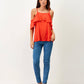 T-shirt con spalle scoperte e volant