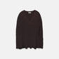 Poncho a maglia a coste con scollo a V