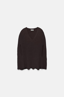 Poncho a maglia a coste con scollo a V