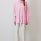 Maglione rosa con collo decorato in perle
