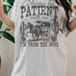 T-shirt oversize grafica "Please Be Patient"