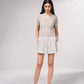 Top in maglia lurex con cut-out frontale