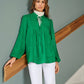 Tunica jacquard verde con fiocco al collo