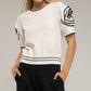 Maglia in cotone con maniche a rosetta