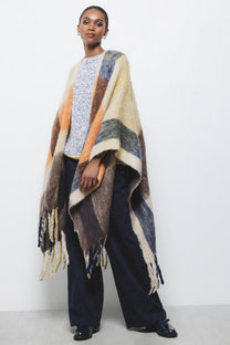 Poncho a quadri con frange