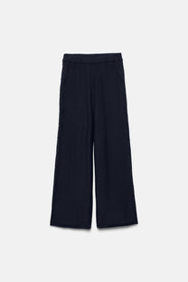 Pantaloni larghi in maglia con dettagli crochet