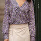 Blusa stampata floreale con scollo a V