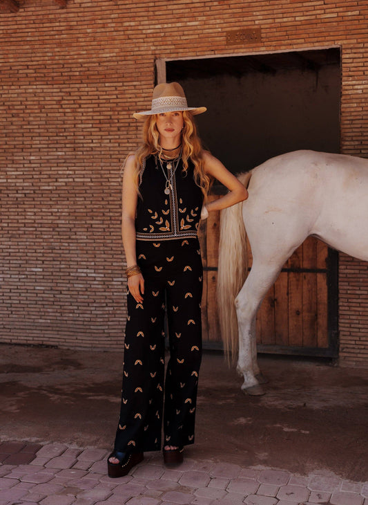 Pantaloni neri a vita alta svasati in cotone