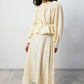 Set coordinato crema con blusa peplo e gonna maxi