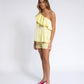 Blusa monospalla con volant