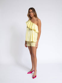Blusa monospalla con volant
