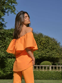 Top off-shoulder con volant in popeline