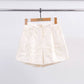 Shorts in raso con ricamo floreale