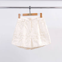 Shorts in raso con ricamo floreale