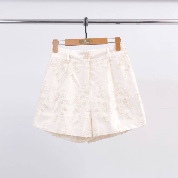 Shorts in raso con ricamo floreale