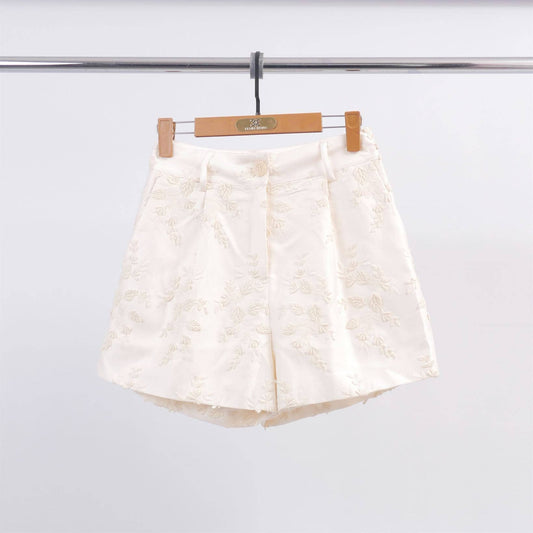 Shorts in raso con ricamo floreale