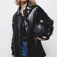 Trench coat effetto pelle nero lucido