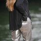 Pantaloni metallizzati argento a vita alta