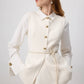 Gilet aderente crema con bottoni dorati