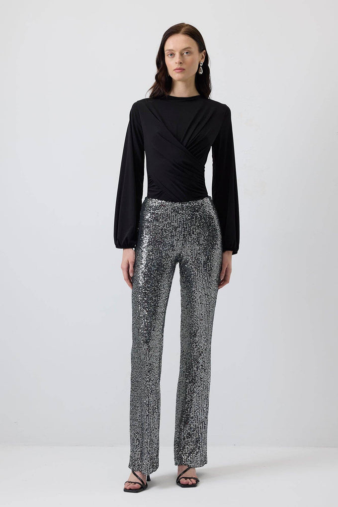 Pantaloni a zampa con paillettes