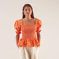 Blusa elasticizzata arancione a maniche a sbuffo