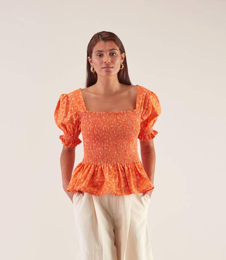 Blusa elasticizzata arancione a maniche a sbuffo