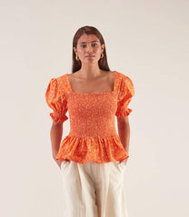 Blusa elasticizzata arancione a maniche a sbuffo