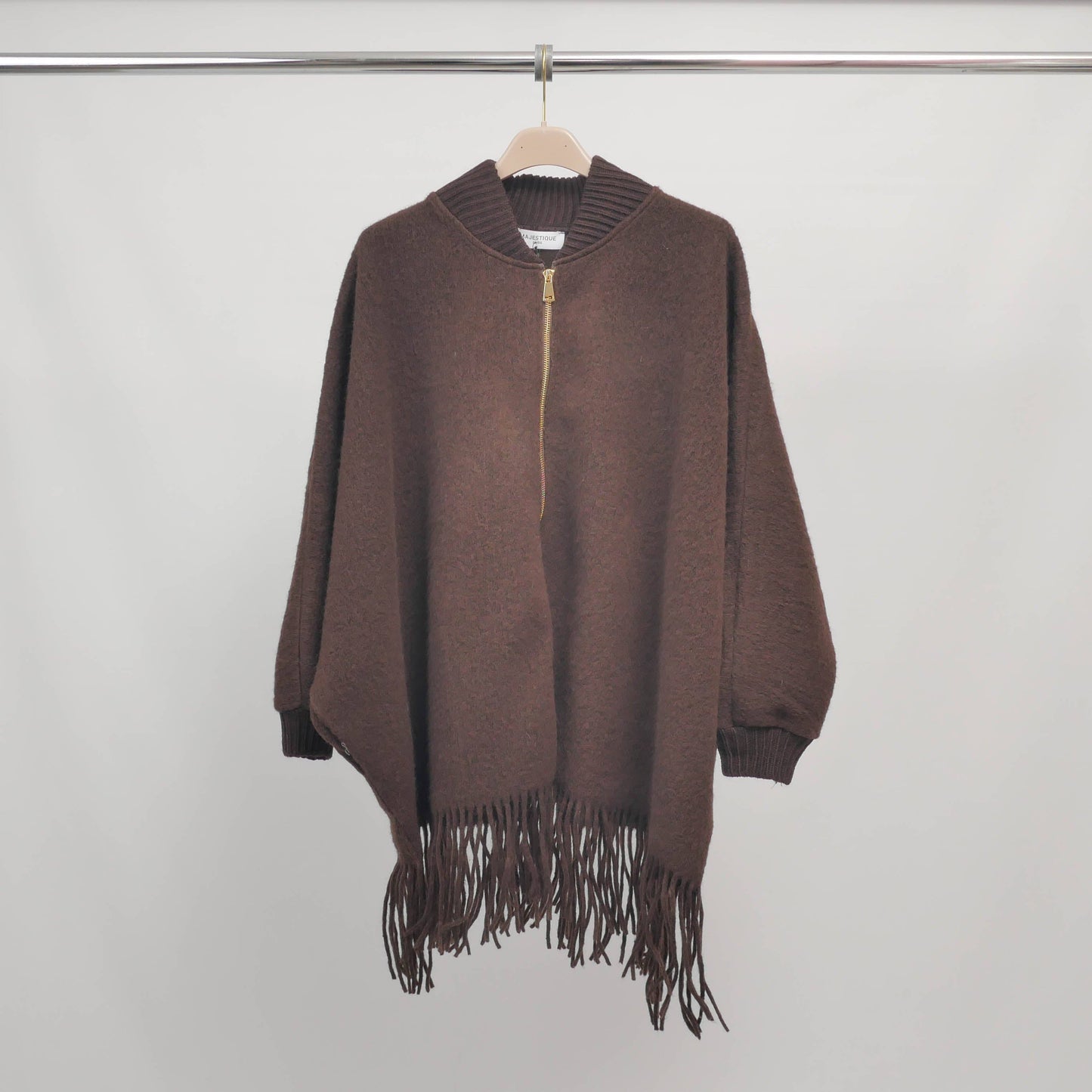 Poncho in maglia con frange e zip, maniche a pipistrello