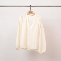 Blusa testurizzata con bottoni e scollo a V