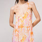 Vestito lungo fluido con scollo a V e stampa astratta