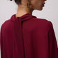 Abito in chiffon bordeaux con maniche a pipistrello