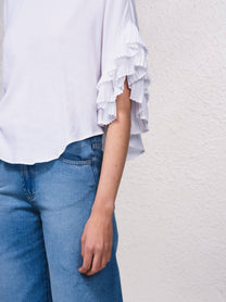 Blusa fluida con maniche a volant plissé