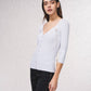 Cardigan in maglia a coste con catene dorate