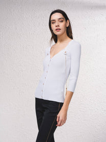 Cardigan in maglia a coste con catene dorate