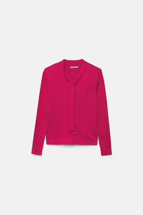 Maglione in maglia rasata con fiocco e scollo a V