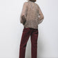 Blusa semitrasparente animalier con collo alto