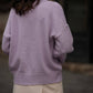 Maglia in maglia traforata con scollo a V