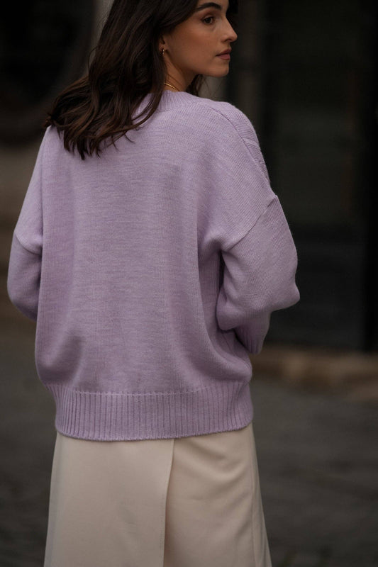 Maglia in maglia traforata con scollo a V