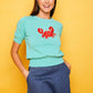 Top in maglia verde con ricamo granchio