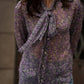 Blusa floreale lilla con fiocco