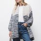 Cardigan bicolore in maglia con collo a scialle