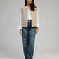 Cardigan smanicato in maglia beige