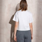 T-shirt bianca con applicazione lucida