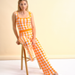 Pantaloni in maglia a fantasia arancio e bianco
