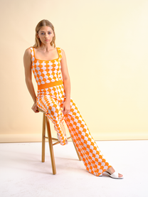 Pantaloni in maglia a fantasia arancio e bianco