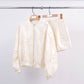 Shorts in raso con ricamo floreale