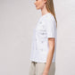T-shirt bianca con applicazioni brillanti