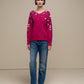 Maglione in maglia con paillettes sulle maniche