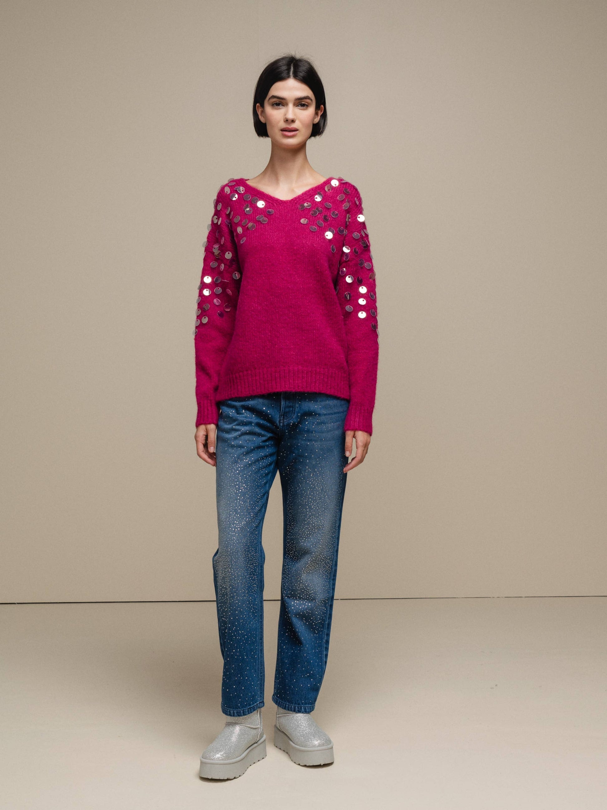 Maglione in maglia con paillettes sulle maniche