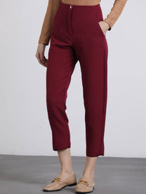 Pantaloni cropped bordeaux con bottoni dorati